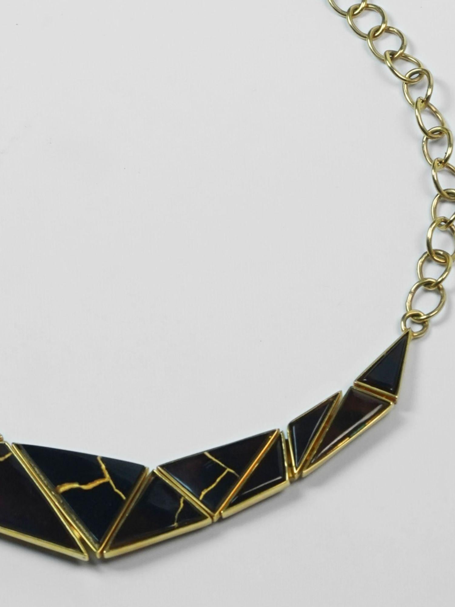 Tsugumi kintsugi collar necklace with chain clasp shown on neutral background, full piece visible.