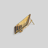 Side angle product shot of Vélora blue CZ earring showing layered diamond depth in 24k gold.