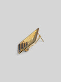Side angle product shot of Vélora blue CZ earring showing layered diamond depth in 24k gold.