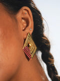 Close profile of Vélora pink cubic zirconia layered diamond statement earring worn on model.