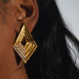Vélora geometric diamond statement earring with white CZ worn in profile close-up on model.