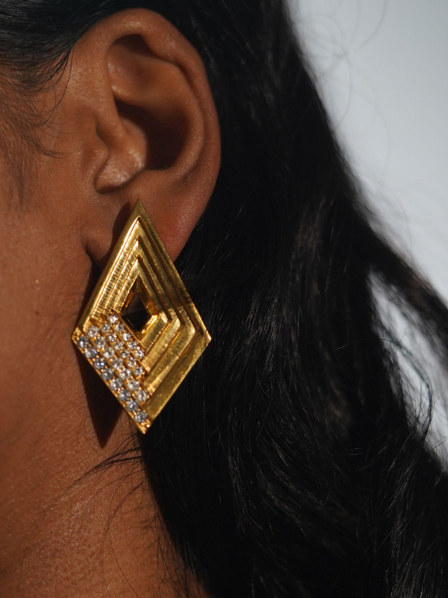 Vélora geometric diamond statement earring with white CZ worn in profile close-up on model.