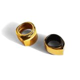 Two-tone gold and black rhodium dual cocktail rings on white background