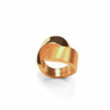 Wide-band gold ribbon ring with high polish finish, product shot on white